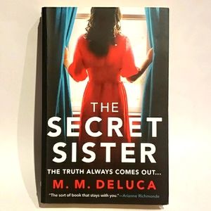 "The Secret Sister"  by M. M. DeLuca. Soft cover book.
